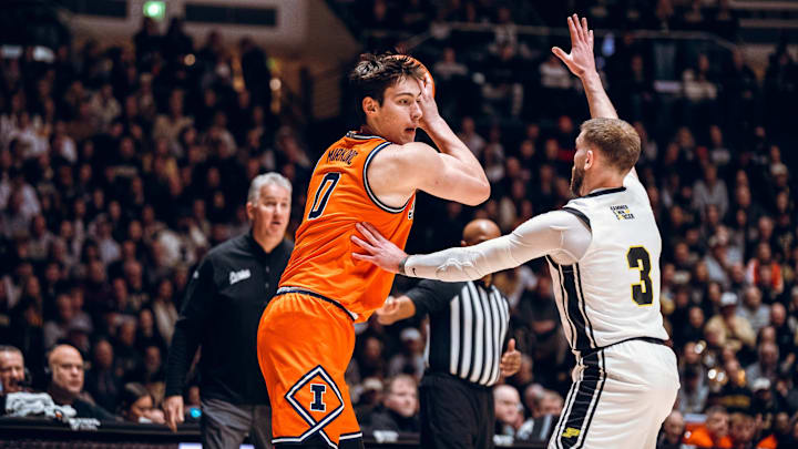 Illinois forward David Mirkovic (0) squares up against Purdue guard Braden Smith (3) in the Illini's 88-82 win over the Boilermakers on Saturday at Mackey Arena in West Lafayette, Indiana.