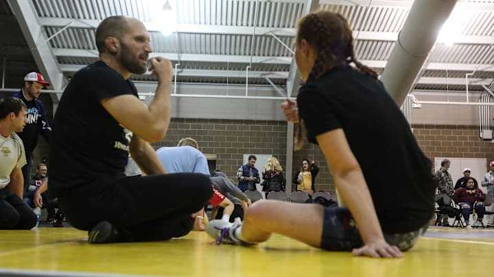 Becca Roper's coach and husband, Lee Roper, coaches her in her first career match on Friday, Oct. 29, 2021, at the StaleMates II competition at the Elwell Family Food Center at the Iowa State Fairgrounds, Des Moines.

Ay1i7476