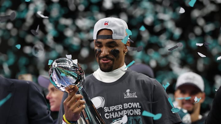Feb 9, 2025; New Orleans, LA, USA; Philadelphia Eagles quarterback Jalen Hurts holds the Lombardi Trophy during the championship trophy presentation after the Eagles' game against the Kansas City Chiefs in Super Bowl LIX at Caesars Superdome. Mandatory Credit: Geoff Burke-Imagn Images Feb 9, 2025; New Orleans, LA, USA; Philadelphia Eagles quarterback Jalen Hurts holds the Lombardi Trophy during the championship trophy presentation after the Eagles' game against the Kansas City Chiefs in Super Bowl LIX at Caesars Superdome. Mandatory Credit: Geoff Burke-Imagn Images