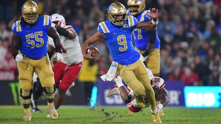  UCLA Bruins quarterback Nico Iamaleava moments before being tripped up by Nebraska Cornhuskers linebacker Dylan Rogers.