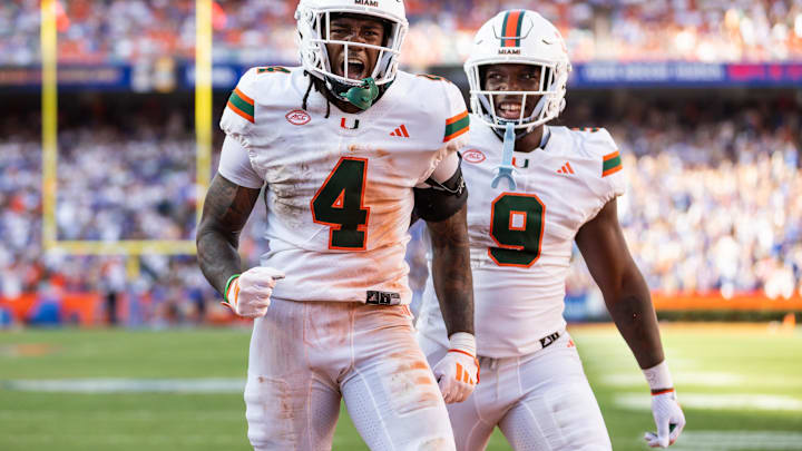 Aug 31, 2024; Gainesville, Florida, USA; Miami Hurricanes running back Mark Fletcher Jr. (4) and Miami Hurricanes tight end Elija Lofton (9) celebrate after a touchdown against the Florida Gators during the second half at Ben Hill Griffin Stadium. Mandatory Credit: Matt Pendleton-Imagn Images