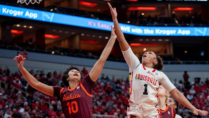 Feb. 18, 2024; Louisville guard Sydney Taylor (1) goes for a layup against Virginia Tech forward Carys Baker (10).