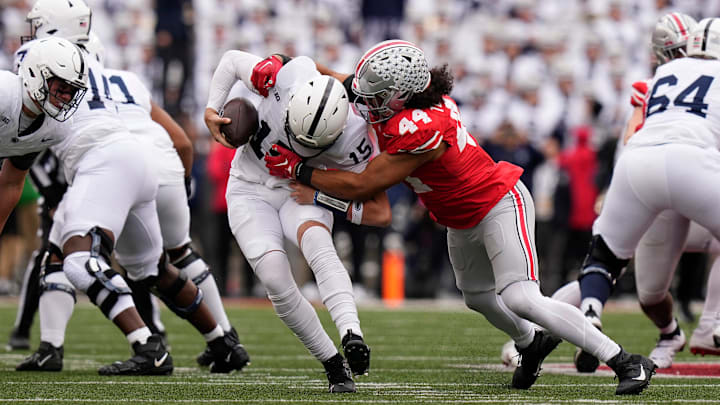 Ohio State Buckeyes defensive end JT Tuimoloau (44) sacks Penn State Nittany Lions quarterback Drew Allar (15) during the second half of the NCAA football game at Ohio Stadium in 2023. Ohio State Buckeyes defensive end JT Tuimoloau (44) sacks Penn State Nittany Lions quarterback Drew Allar (15) during the second half of the NCAA football game at Ohio Stadium in 2023.