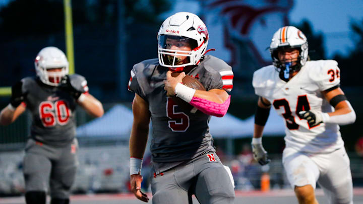 Nixa's Dylan Rebura carries the ball as the Eagles took on the Republic Tigers at Nixa on Friday, Aug. 30, 2024.