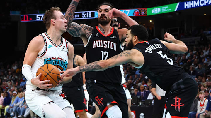 Memphis Grizzlies guard Luke Kennard (10) drives to the basket as Houston Rockets center Steven Adams (12) and guard Fred VanVleet (5) defend during the second quarter at FedExForum.