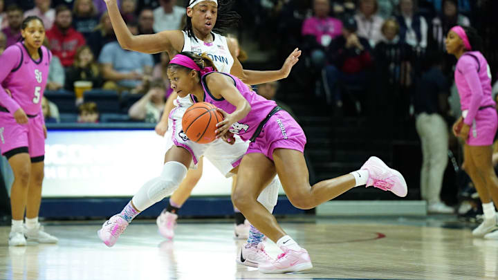 UConn Huskies guard KK Arnold (2) defends against St. John's Red Storm guard Tara Daye (44) 