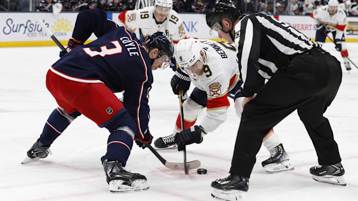Blue Jackets center Charlie Coyle faces off against Panthers center Sam Bennett.
