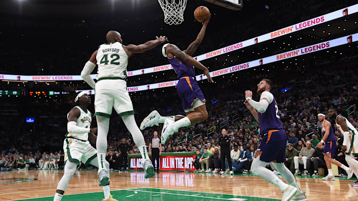 Mar 14, 2024; Boston, Massachusetts, USA: Phoenix Suns guard Bradley Beal (3) drives to the basket past Boston Celtics center Al Horford (42) during the first half at TD Garden. Mandatory Credit: Bob DeChiara-Imagn Images