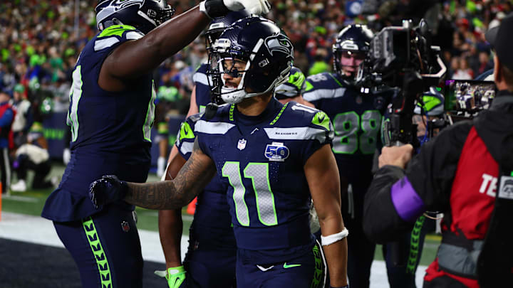 Seattle Seahawks WR Jaxon Smith-Njigba reacts with teammates after catching a touchdown pass against the San Francisco 49ers.