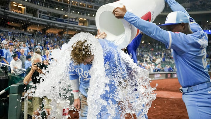 Sep 6, 2025; Kansas City, Missouri, USA; Kansas City Royals designated hitter Carter Jensen (22) is doused by second baseman Tyler Tolbert (2) and center fielder Kyle Isbel (28) after the win over the Minnesota Twins at Kauffman Stadium. Mandatory Credit: Denny Medley-Imagn Images