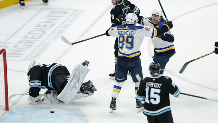 Feb 2, 2025; Salt Lake City, Utah, USA; St. Louis Blues center Jordan Kyrou (25) and left wing Pavel Buchnevich (89) celebrate a Blues goal against the Utah Hockey Club during the third period at Delta Center. Mandatory Credit: Chris Nicoll-Imagn Images