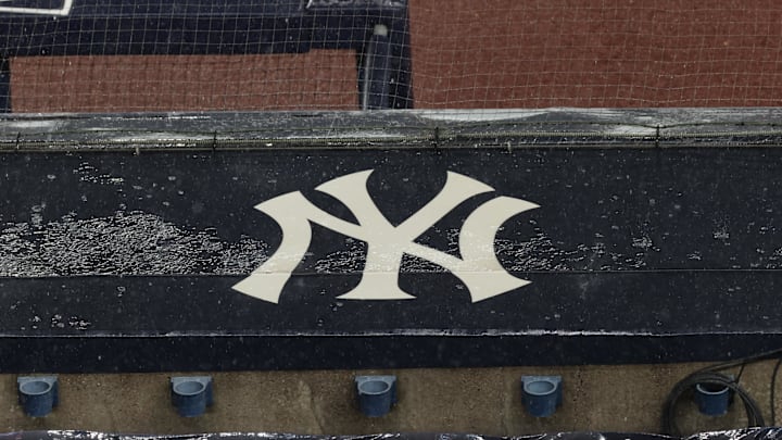 Aug 17, 2020; Bronx, New York, USA; A general view of rain falling on the New York Yankees logo on the first base dugout roof during a rain delay in the game between the New York Yankees and the Boston Red Sox. Mandatory Credit: Vincent Carchietta-Imagn Images Aug 17, 2020; Bronx, New York, USA; A general view of rain falling on the New York Yankees logo on the first base dugout roof during a rain delay in the game between the New York Yankees and the Boston Red Sox. Mandatory Credit: Vincent Carchietta-Imagn Images