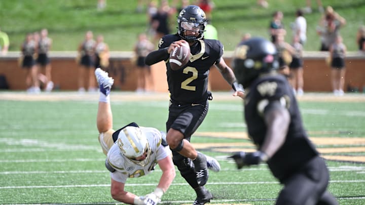 Sep 27, 2025; Winston-Salem, North Carolina, USA;  Georgia Tech Yellow Jackets defensive lineman Jordan van den Berg (99) attempts to tackle Wake Forest Demon Deacons quarterback Robby Ashford (2) during the fourth quarter at Allegacy Federal Credit Union Stadium. Mandatory Credit: Zachary Taft-Imagn Images