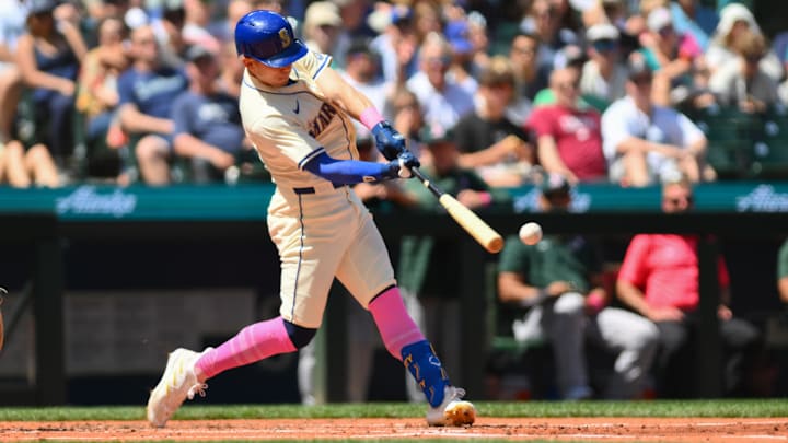 Seattle Mariners left fielder Sam Haggerty hits a single against the Oakland Athletics on May 12 at T-Mobile Park.