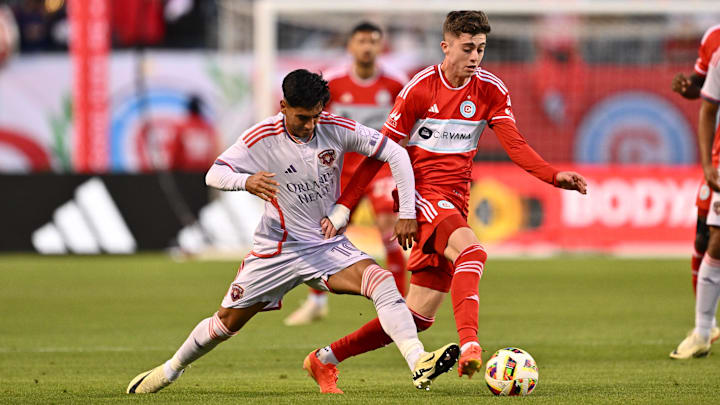 May 29, 2024; Chicago, Illinois, USA;  Orlando City SC midfielder Facundo Torres (10) and Chicago Fire FC midfielder Brian Gutierrez (17) battle for control of the ball in the first half at Soldier Field. Mandatory Credit: Jamie Sabau-USA TODAY Sports