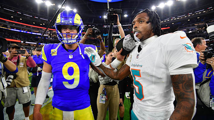 Nov 11, 2024; Inglewood, California, USA; Los Angeles Rams quarterback Matthew Stafford (9) meets with Miami Dolphins cornerback Jalen Ramsey (5) following the game at SoFi Stadium. Mandatory Credit: Gary A. Vasquez-Imagn Images
