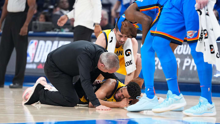 Jun 22, 2025; Oklahoma City, Oklahoma, USA; Indiana Pacers guard Tyrese Haliburton (0) reacts after suffering an injury during the first quarter against the Oklahoma City Thunder during game seven of the 2025 NBA Finals at Paycom Center. Mandatory Credit: Kyle Terada-Imagn Images Jun 22, 2025; Oklahoma City, Oklahoma, USA; Indiana Pacers guard Tyrese Haliburton (0) reacts after suffering an injury during the first quarter against the Oklahoma City Thunder during game seven of the 2025 NBA Finals at Paycom Center. Mandatory Credit: Kyle Terada-Imagn Images