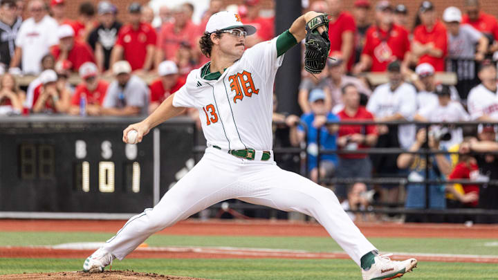 Miami pitcher Griffin Hugus winds up during the NCAA baseball Super Regional game 2 at Jim Patterson Stadium on June 7, 2025 in Louisville, Ky.