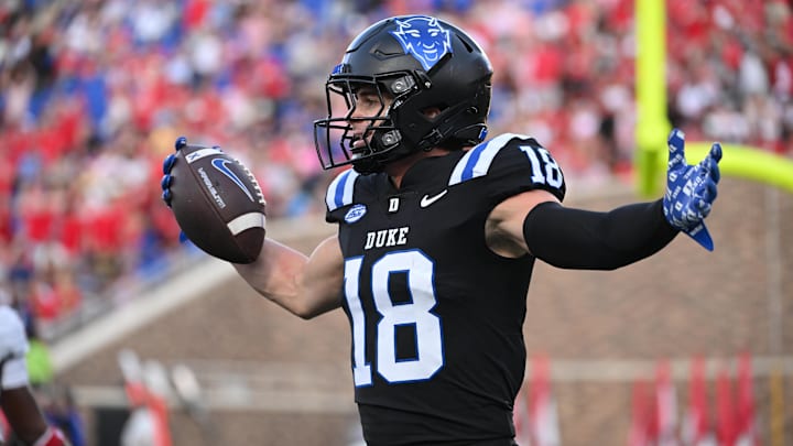 Sep 20, 2025; Durham, North Carolina, USA;  Duke Blue Devils wide receiver Cooper Barkate (18) celebrates a touchdown during the third quarter against the NC State Wolfpack at Wallace Wade Stadium. Mandatory Credit: Zachary Taft-Imagn Images