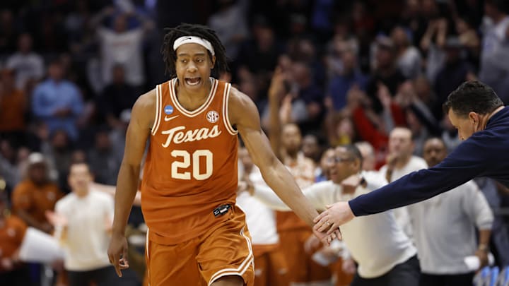 Mar 19, 2025; Dayton, OH, USA; Texas Longhorns guard Tre Johnson (20) high fives Xavier Musketeers head coach Sean Miller after making a three point basket in the second half at UD Arena. Mandatory Credit: Rick Osentoski-Imagn Images Mar 19, 2025; Dayton, OH, USA; Texas Longhorns guard Tre Johnson (20) high fives Xavier Musketeers head coach Sean Miller after making a three point basket in the second half at UD Arena. Mandatory Credit: Rick Osentoski-Imagn Images