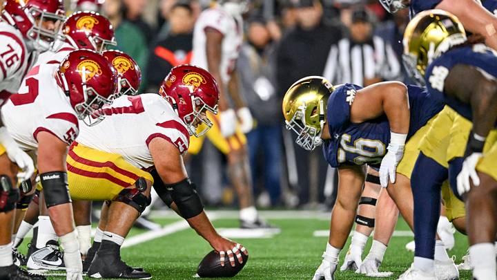 Oct 14, 2023; South Bend, Indiana, USA; USC Trojans center Justin Dedich (57) prepares to snap as Notre Dame Fighting Irish defensive lineman Howard Cross III (56) defends in the second quarter at Notre Dame Stadium. Oct 14, 2023; South Bend, Indiana, USA; USC Trojans center Justin Dedich (57) prepares to snap as Notre Dame Fighting Irish defensive lineman Howard Cross III (56) defends in the second quarter at Notre Dame Stadium.