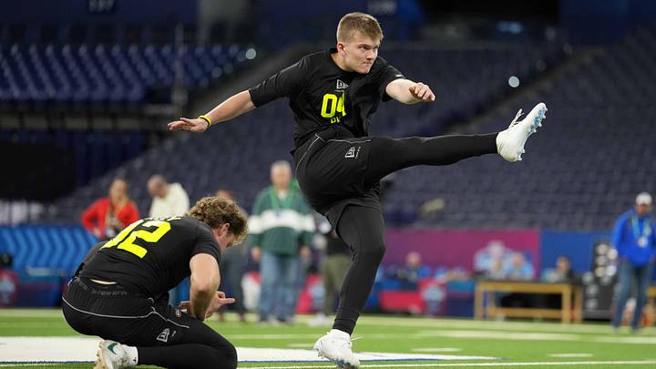 Feb 25, 2026; Indianapolis, IN, USA; Iowa place kicker Drew Stevens (PK04) kicks the ball out of the hold of Ryan Eckley of Michigan State during the NFL Scouting Combine at Lucas Oil Stadium. Mandatory Credit: Kirby Lee-Imagn Images Feb 25, 2026; Indianapolis, IN, USA; Iowa place kicker Drew Stevens (PK04) kicks the ball out of the hold of Ryan Eckley of Michigan State during the NFL Scouting Combine at Lucas Oil Stadium. Mandatory Credit: Kirby Lee-Imagn Images
