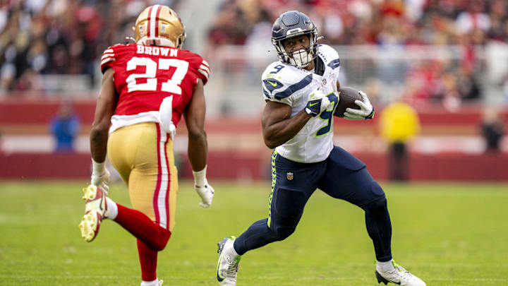 Seattle Seahawks running back Kenneth Walker III runs the football against the 49ers