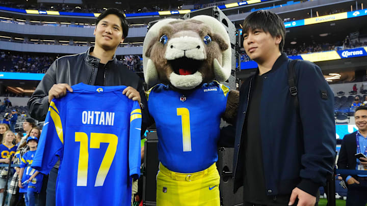 Dec 21, 2023; Inglewood, California, USA; Los Angeles Dodgers player Shohei Ohtani (left) and interpreter Ippei Mizuhara (right) pose with Los Angeles Rams mascot Rampage (center) at SoFi Stadium. Mandatory Credit: Kirby Lee-Imagn Images Dec 21, 2023; Inglewood, California, USA; Los Angeles Dodgers player Shohei Ohtani (left) and interpreter Ippei Mizuhara (right) pose with Los Angeles Rams mascot Rampage (center) at SoFi Stadium. Mandatory Credit: Kirby Lee-Imagn Images