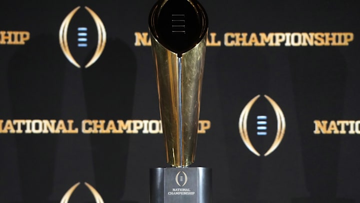 The College Football Playoff National Championship trophy at a press conference