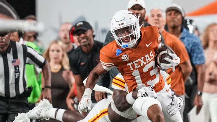 Texas Longhorns defensive back Jay'Vion Cole (13) runs the ball forward following an interception as the Texas Longhorns take on ULM at Darrell K Royal-Texas Memorial Stadium in Austin Saturday, Sept. 21, 2024.