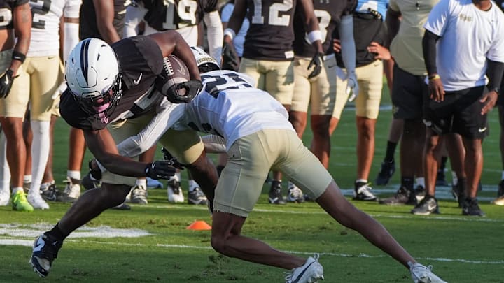 UCF running back Agyeman Addae competes with Rukeem Stroud during UCF Spring football practice at FBC Mortgage Stadium in Orlando, Friday, April 11, 2025.