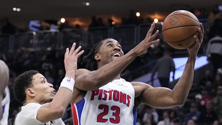 Nov 22, 2025; Milwaukee, Wisconsin, USA; Detroit Pistons guard Jaden Ivey (23) puts up a shot against Milwaukee Bucks guard Ryan Rollins (13) in the second half at Fiserv Forum. Mandatory Credit: Michael McLoone-Imagn Images Nov 22, 2025; Milwaukee, Wisconsin, USA; Detroit Pistons guard Jaden Ivey (23) puts up a shot against Milwaukee Bucks guard Ryan Rollins (13) in the second half at Fiserv Forum. Mandatory Credit: Michael McLoone-Imagn Images