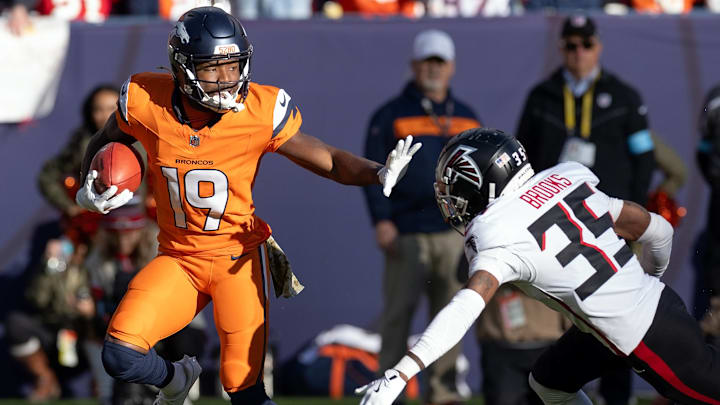 November 17, 2024, Denver, Colorado, USA: Broncos MARVIN MIMS JR. readies to stiff arm Falcons CB NATRONE BROOKS while returning a punt during the 1st. Half at Empower Field at Mile High Sunday afternoon. The Broncos beat the Falcons 38-6. Denver USA November 17, 2024, Denver, Colorado, USA: Broncos MARVIN MIMS JR. readies to stiff arm Falcons CB NATRONE BROOKS while returning a punt during the 1st. Half at Empower Field at Mile High Sunday afternoon. The Broncos beat the Falcons 38-6. Denver USA