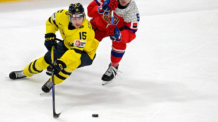 Jan 5, 2026; St. Paul, Minnesota, USA; Sweden forward Ivar Stenberg (15) controls the puck as Czechia defensemen Radim Mrtka (6) gives chase during the first period in the final of the 2026 IIHF World Junior Championship ice hockey tournament at Grand Casino Arena. Mandatory Credit: Nick Wosika-Imagn Images