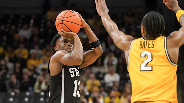 Feb 10, 2024; Columbia, Missouri, USA; Mississippi State Bulldogs guard Josh Hubbard (13) shoots as Missouri Tigers guard Tamar Bates (2) defends during the second half at Mizzou Arena. Mandatory Credit: Denny Medley-Imagn Images