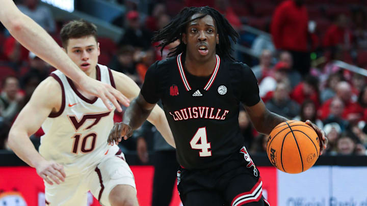 Louisville basketball's Ty-Laur Johnson (4) drives against Virginia Tech during their game at the