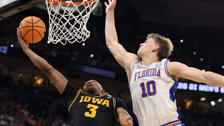 Mar 22, 2026; Tampa, FL, USA; Iowa Hawkeyes forward Cam Manyawu (3) shoots past Florida Gators forward Thomas Haugh (10) in the second half during a second round game of the men's 2026 NCAA Tournament at Benchmark International Arena. Mandatory Credit: Nathan Ray Seebeck-Imagn Images