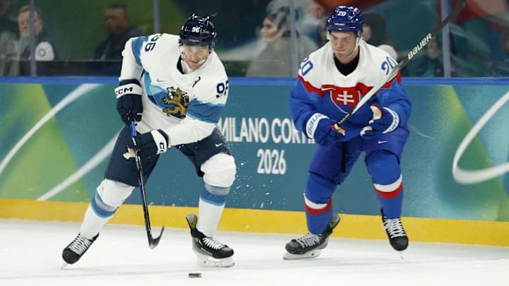 Feb 11, 2026; Milan, Italy; Mikko Rantanen of Finland in action with Juraj Slafkovsky of Slovakia in men's ice hockey group B play during the Milano Cortina 2026 Olympic Winter Games at Milano Santagiulia Ice Hockey Arena. Mandatory Credit: Geoff Burke-Imagn Images Feb 11, 2026; Milan, Italy; Mikko Rantanen of Finland in action with Juraj Slafkovsky of Slovakia in men's ice hockey group B play during the Milano Cortina 2026 Olympic Winter Games at Milano Santagiulia Ice Hockey Arena. Mandatory Credit: Geoff Burke-Imagn Images
