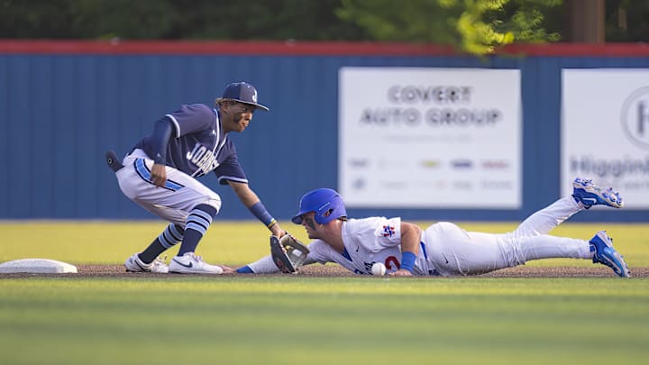 Westlake Chaparrals Blake Peterson (2) slides into 2nd base ahead of the tag from SA Johnson Jaguars Kayson Cunningham (6) at the UIL Regional IV Final 6A baseball Round 1 playoff on Thursday, June 1, 2023, at Westlake High School in West Lake Hills, TX.