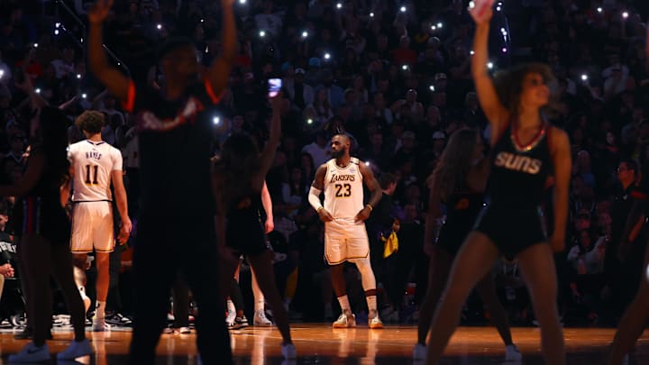 Nov 26, 2024; Phoenix, Arizona, USA; Los Angeles Lakers forward LeBron James (23) against the Phoenix Suns during an NBA Cup game at Footprint Center. Mandatory Credit: Mark J. Rebilas-Imagn Images Nov 26, 2024; Phoenix, Arizona, USA; Los Angeles Lakers forward LeBron James (23) against the Phoenix Suns during an NBA Cup game at Footprint Center. Mandatory Credit: Mark J. Rebilas-Imagn Images