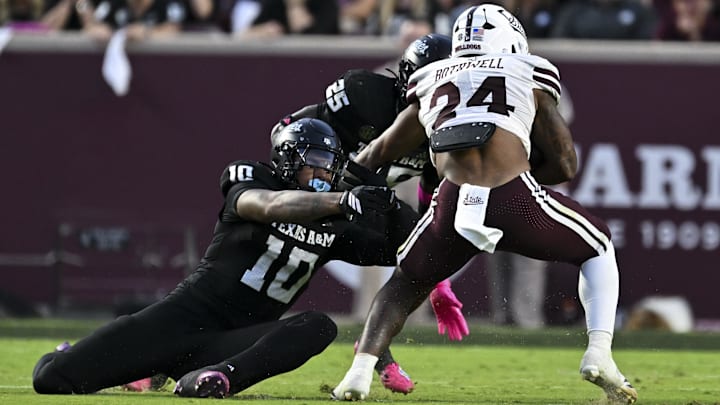 Oct 4, 2025; College Station, Texas, USA; Texas A&M Aggies defensive end Marco Jones (10) tackles Mississippi State Bulldogs running back Fluff Bothwell (24) during the first quarter at Kyle Field. Mandatory Credit: Maria Lysaker-Imagn Images 