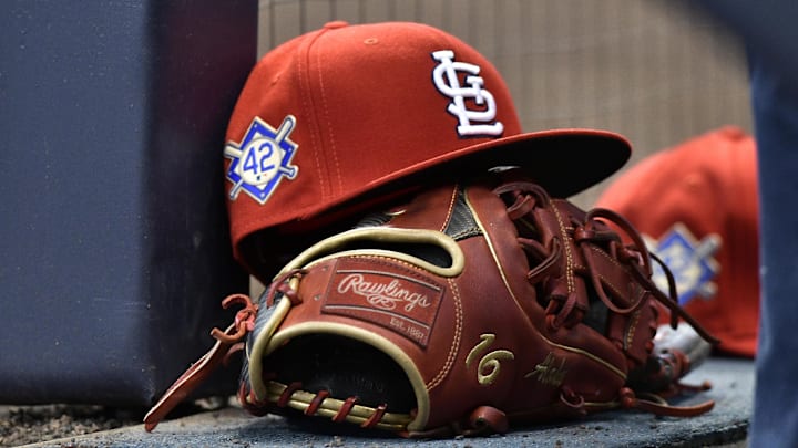 Apr 15, 2019; Milwaukee, WI, USA; A cap rests on the dug out wall with the number 42 on the hat in honor of Major League Baseball   s Jackie Robinson Day. Mandatory Credit: Michael McLoone-Imagn Images
