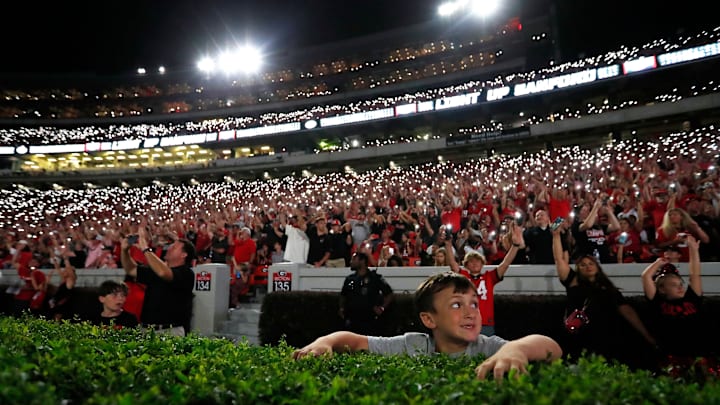 Georgia fans light up Sanford Stadium as the game goes into the fourth during the second half of a NCAA college football game against Tennessee Martin in Athens, Ga., on Saturday, Sept. 2, 2023. Georgia won 48-7.