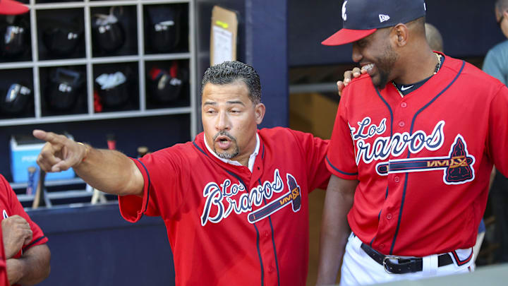 Atlanta, GA, USA; Atlanta Braves former shortstop Rafael Furcal (left) talks to starting pitcher Julio Teheran (49) before a game against the Washington Nationals at SunTrust Park.