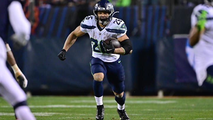 Dec 26, 2024; Chicago, Illinois, USA; Seattle Seahawks running back Zach Charbonnet (26) runs after a catch against the Chicago Bears during the fourth quarter at Soldier Field. Dec 26, 2024; Chicago, Illinois, USA; Seattle Seahawks running back Zach Charbonnet (26) runs after a catch against the Chicago Bears during the fourth quarter at Soldier Field.