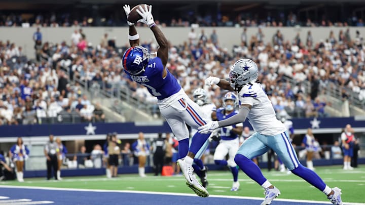 Sep 14, 2025; Arlington, Texas, USA; New York Giants wide receiver Malik Nabers (1) makes a catch for a touchdown against Dallas Cowboys cornerback Trevon Diggs (7). Sep 14, 2025; Arlington, Texas, USA; New York Giants wide receiver Malik Nabers (1) makes a catch for a touchdown against Dallas Cowboys cornerback Trevon Diggs (7).