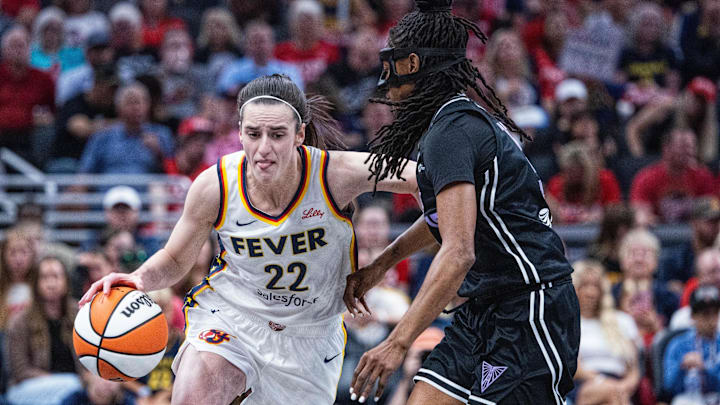 Jul 9, 2025; Indianapolis, Indiana, USA; Indiana Fever guard Caitlin Clark (22) dribbles the ball while Golden State Valkyries guard Tiffany Hayes (15) defends in the first half at Gainbridge Fieldhouse. Mandatory Credit: Trevor Ruszkowski-Imagn Images Jul 9, 2025; Indianapolis, Indiana, USA; Indiana Fever guard Caitlin Clark (22) dribbles the ball while Golden State Valkyries guard Tiffany Hayes (15) defends in the first half at Gainbridge Fieldhouse. Mandatory Credit: Trevor Ruszkowski-Imagn Images