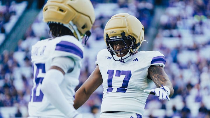 Husky linebacker Deven Bryant (17) is greeted by Ramonz Adams Jr. Husky linebacker Deven Bryant (17) is greeted by Ramonz Adams Jr.