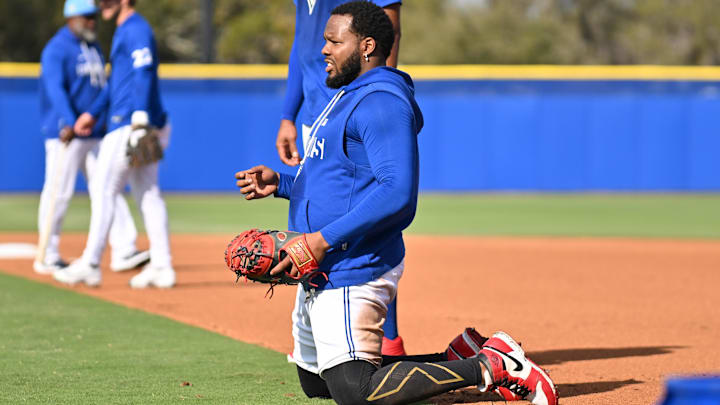 Feb 19, 2026; Dunedin, FL, USA; Toronto Blue Jays infielder Vladimir Guerrero Jr. (27) prepares to take infield during spring training at Bobby Mattick Training Center at Englebert Complex. Mandatory Credit: Jonathan Dyer-Imagn Images