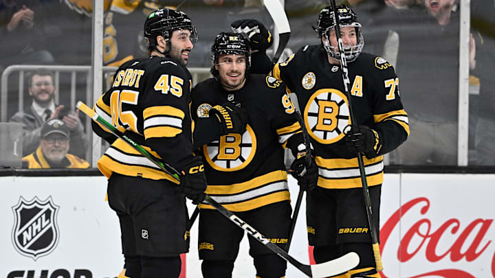 Jan 15, 2026; Boston, Massachusetts, USA; Boston Bruins center Marat Khusnutdinov (92) celebrates his goal against the Seattle Kraken with defenseman Jonathan Aspirot (45) and defenseman Charlie McAvoy (73) during the first period at TD Garden. Mandatory Credit: Eric Canha-Imagn Images